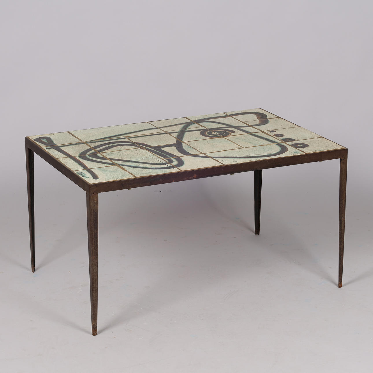 IB WOLFGANG. Rectangular coffee table, frame of patinated iron, tiles of glazed stoneware, signed, Denmark, 1960s.