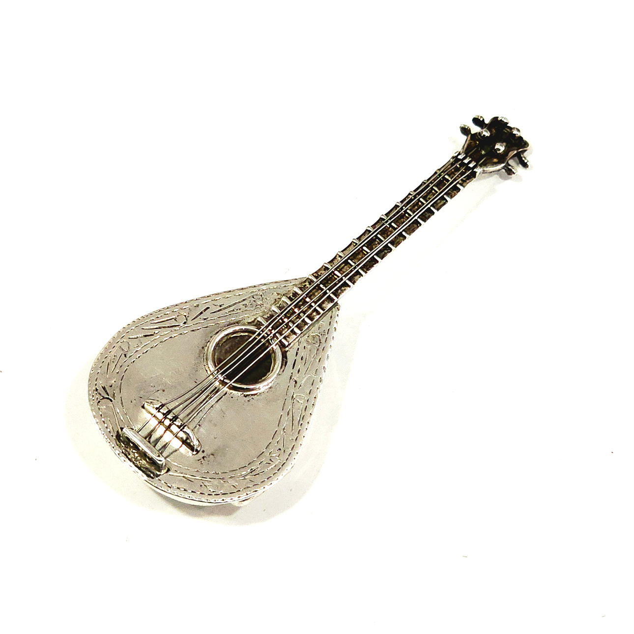 Mandolin pill box in punched sterling silver.