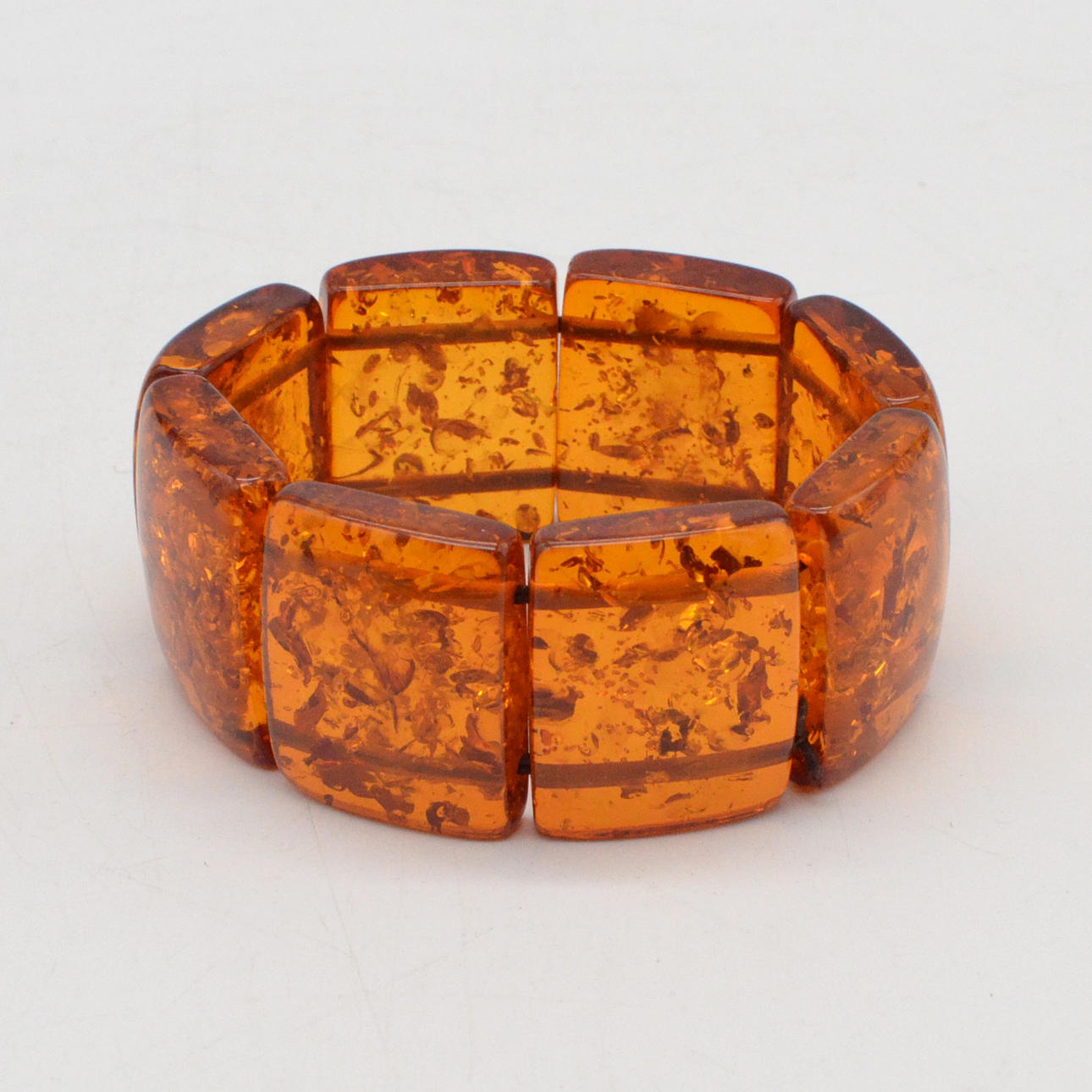 AMBER BRACELET, ELASTIC, FLOWER AND LEAF INCLUSIONS, RECTANGULAR LINKS, VINTAGE, CA 21 CM.