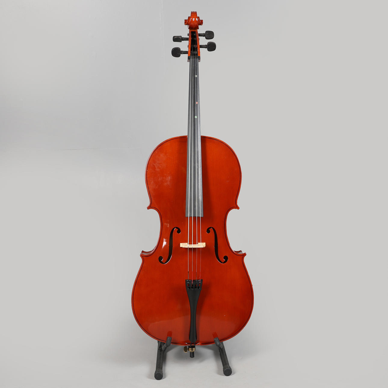 A CASED 4/4 CELLO WITH BOW.