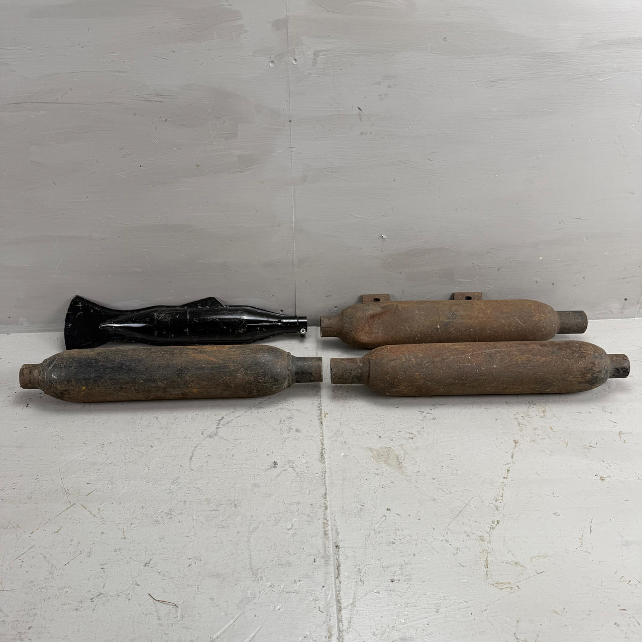 Silencers, four pieces, different models, 1930s/40s.