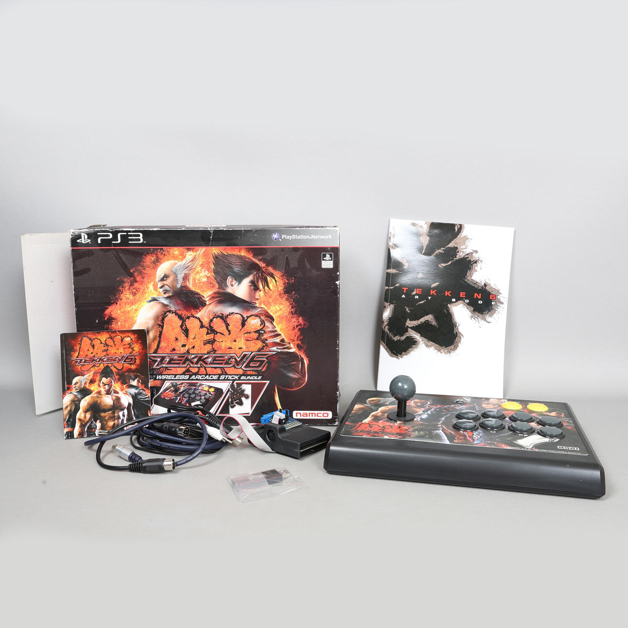 A BOXED PLAYSTATION 3 HORI TEKKEN 6 WIRELESS ARCADE STICK BUNDLE.