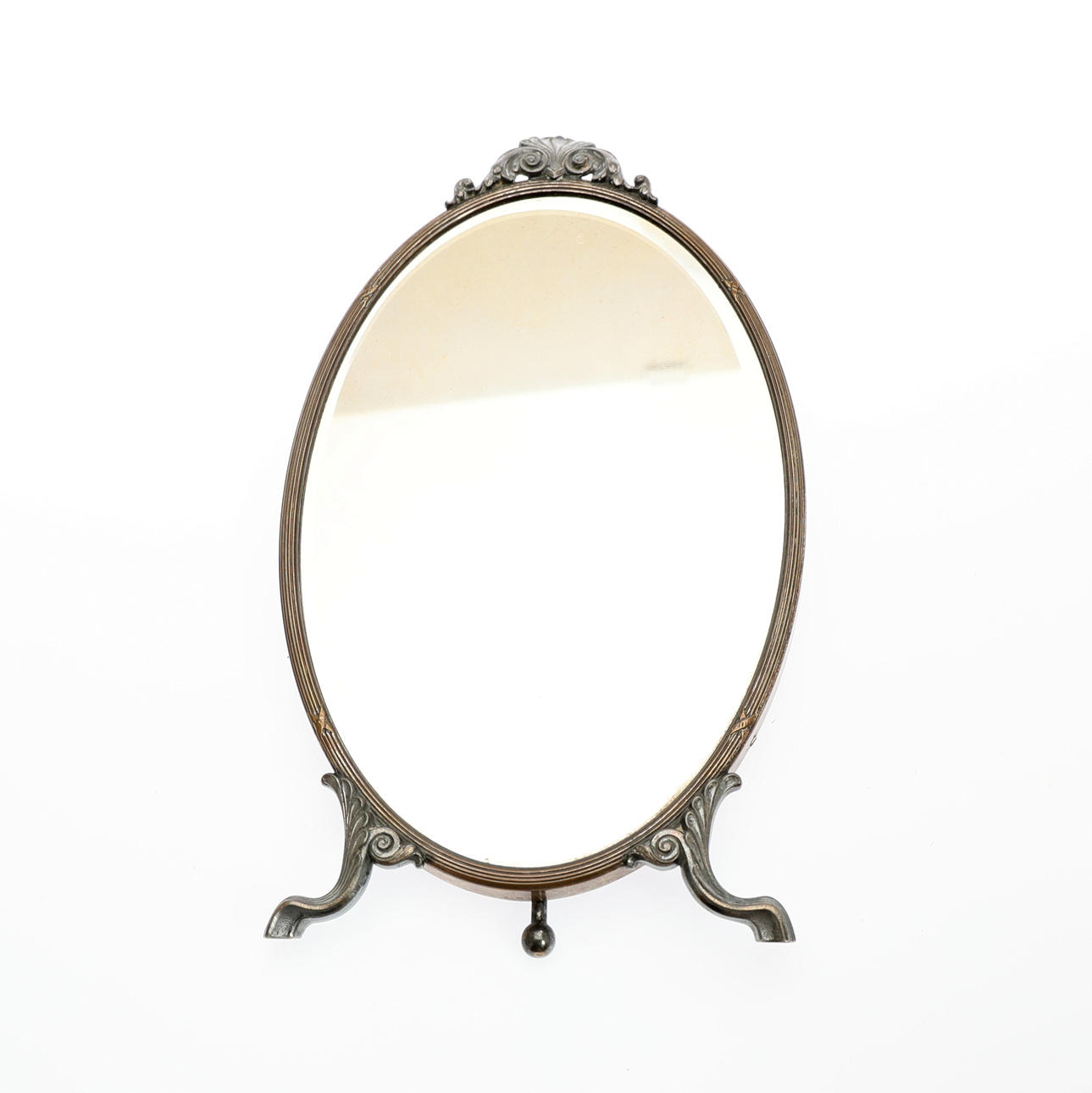 SILVER PLATE MOUNTED OVAL TABLE MIRROR.