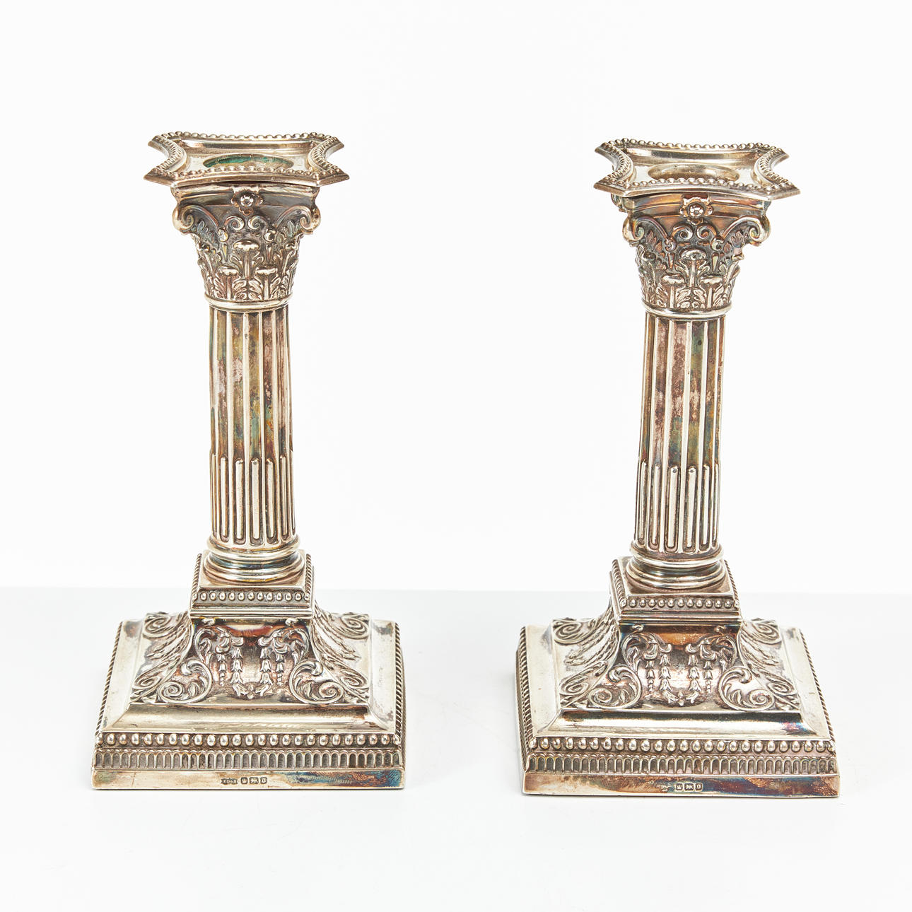 A pair of silver candlesticks, indistinct master's stamp, Sheffield 1906, Louis XVI style.