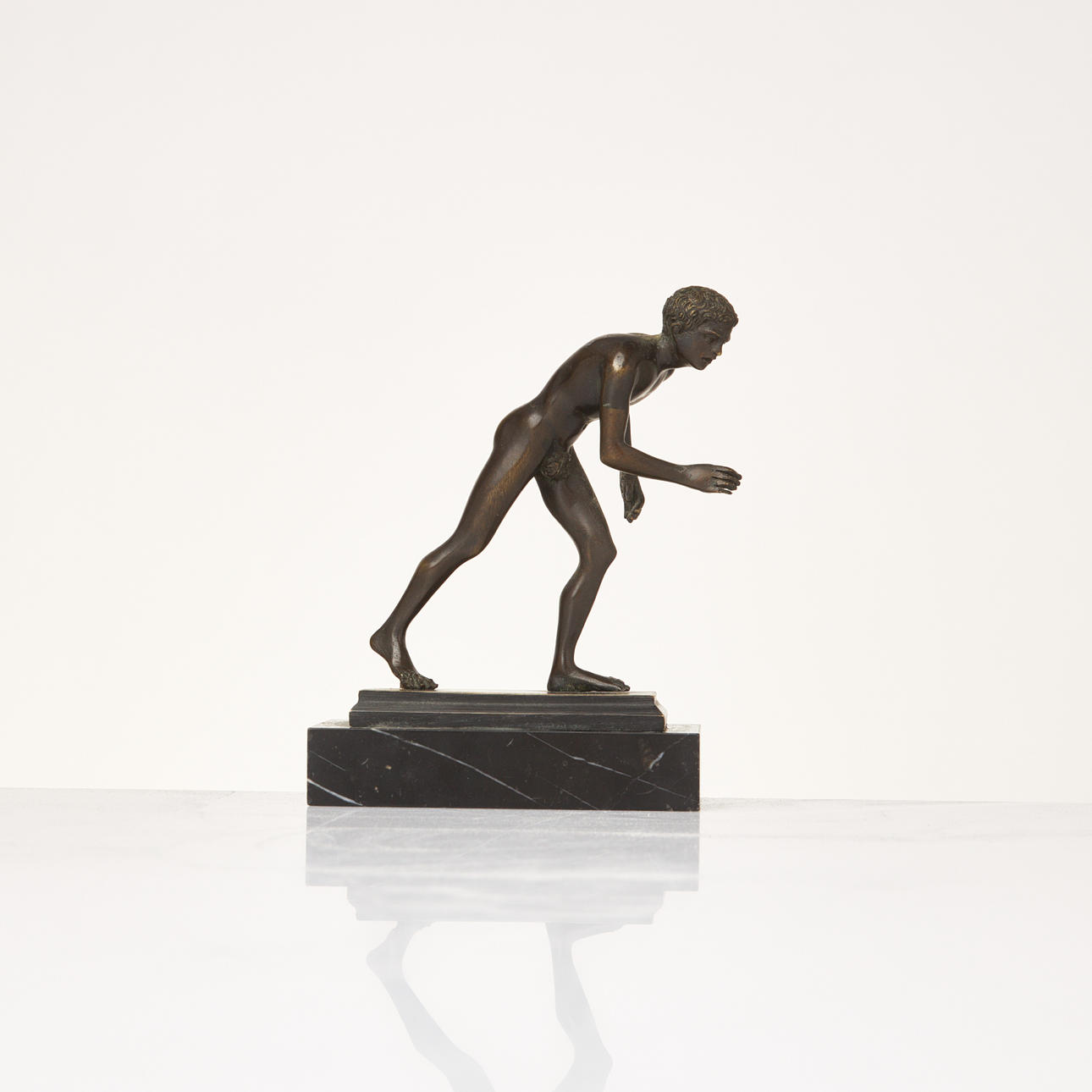 SCULPTURE. Patinated bronze, on marble plinth.