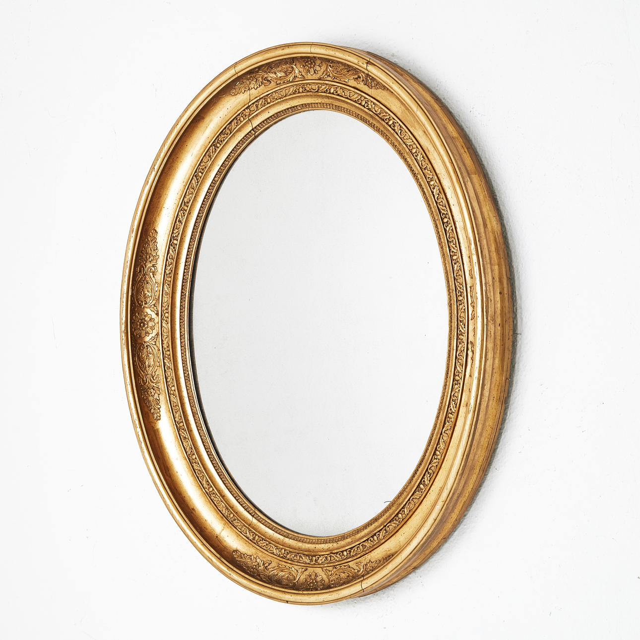 A rococo style mirror, circa 1900.