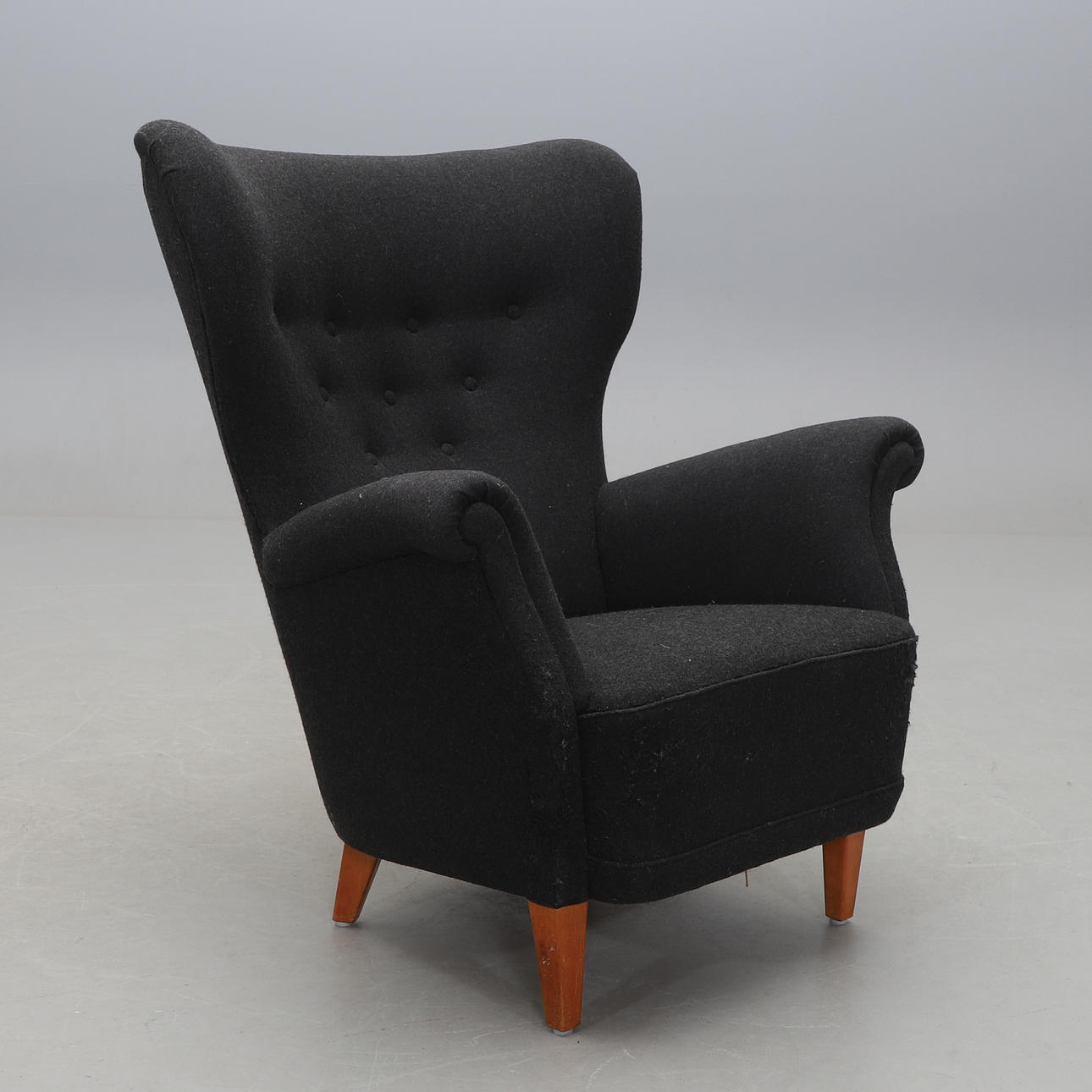 An ear-flap armchair, 1950s/60s.