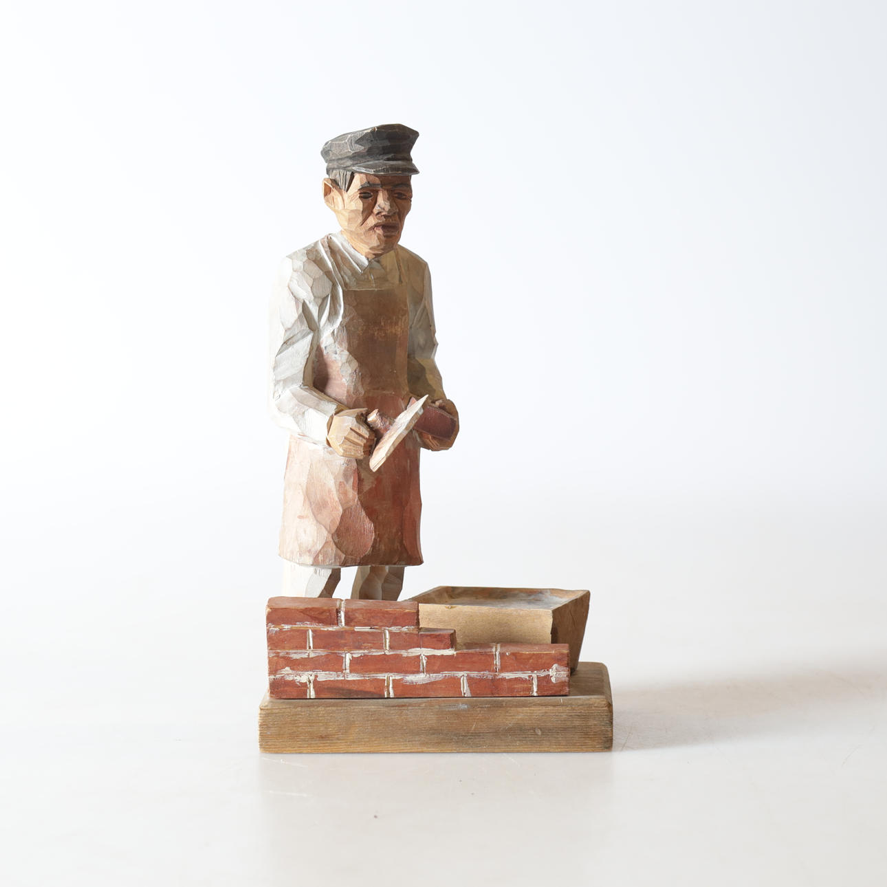 SCULPTURE, cut wood, signed T. Satisfied and dated 1947.