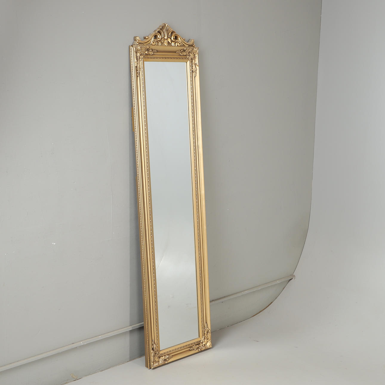 A gilt floor mirror, late 20th century.