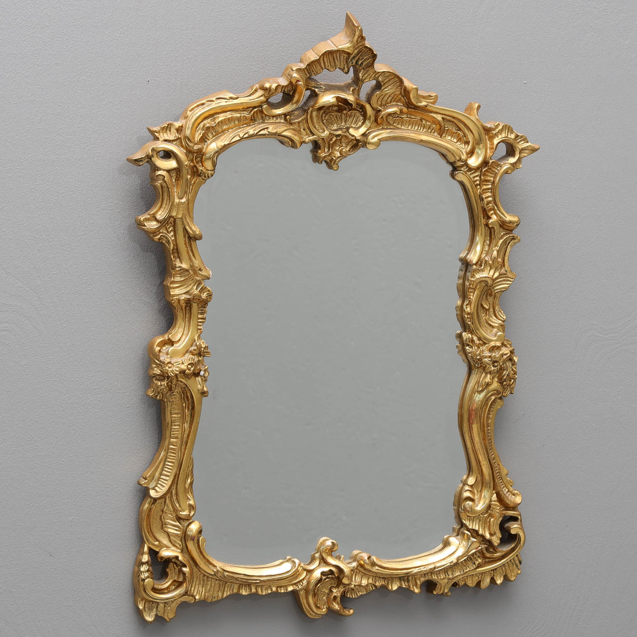 A rococo style mirror, first half of the 20th century.