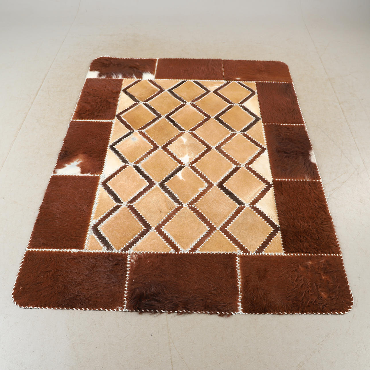 CARPET, cowhide, 192 x 144 cm.