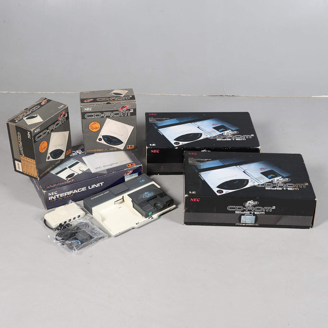 FOUR NEC PC ENGINES, AND TWO PC ENGINE CD-ROMS (6).