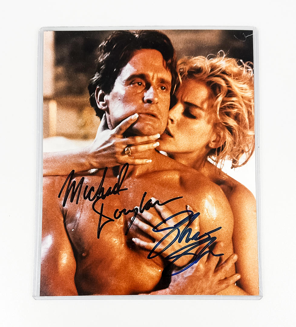 SIGNED PHOTOGRAPH, from the film “Basic Instinct”, Michael Douglas & Sharon Stone.