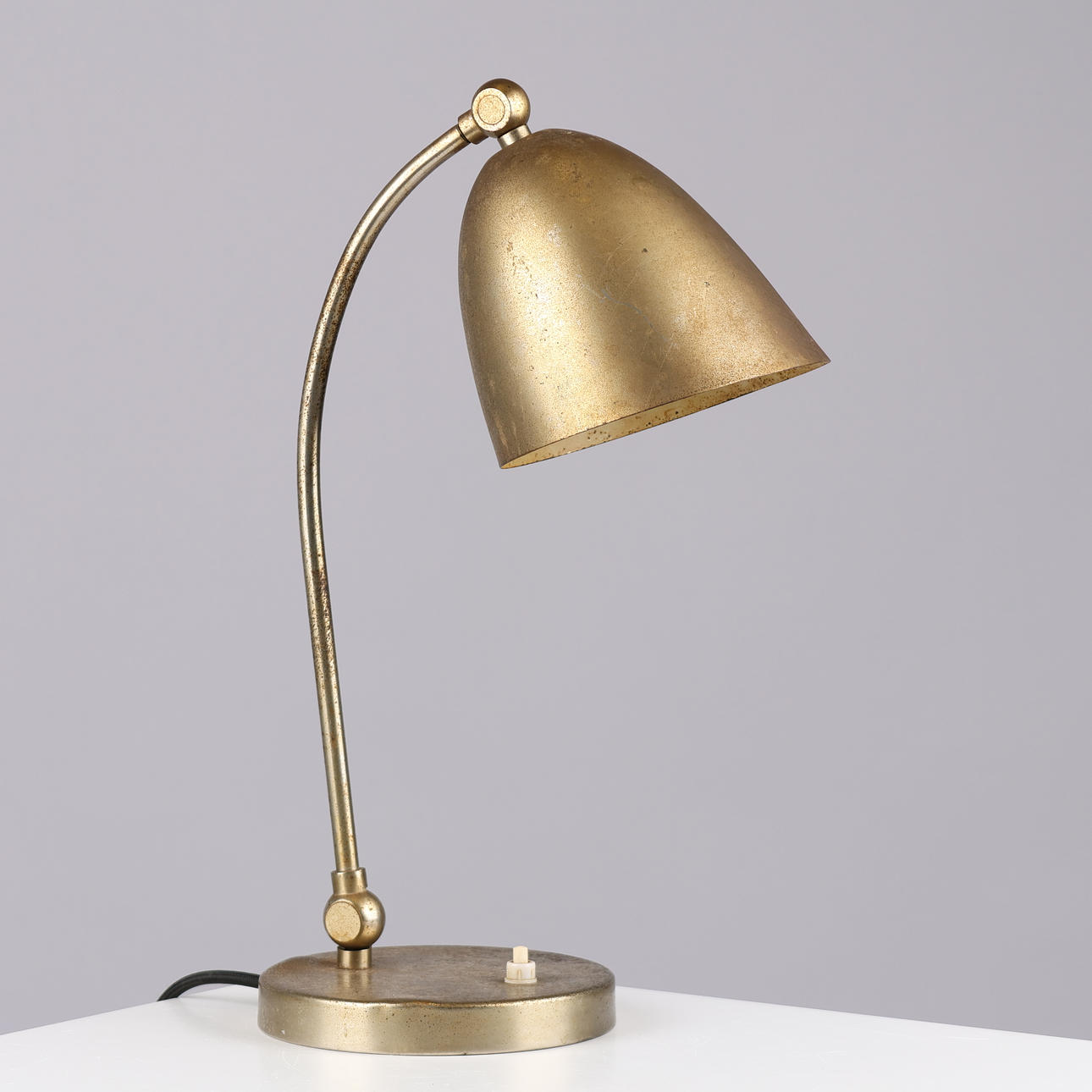ATTRIBUTED TO CHRISTIAN DELL. Adjustable brass table lamp/wall lamp, Le Phare, Switzerland, circa 1940s.