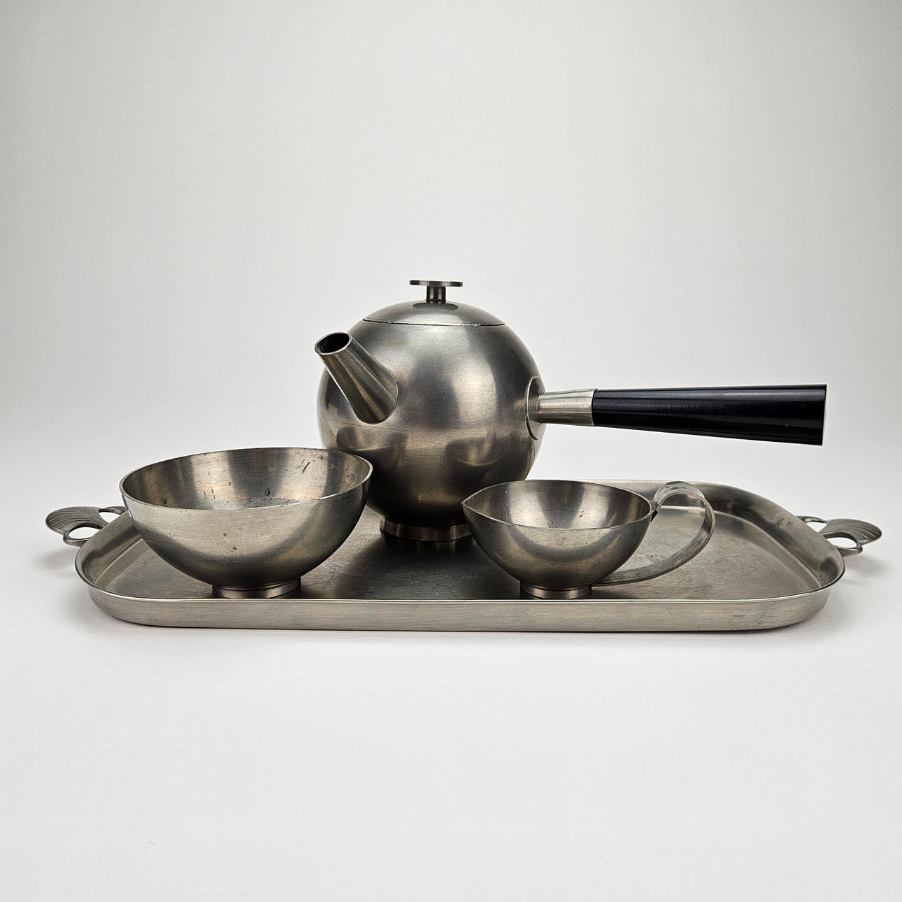 A 4-piece pewter TABLEWARE, GAB, 1931.