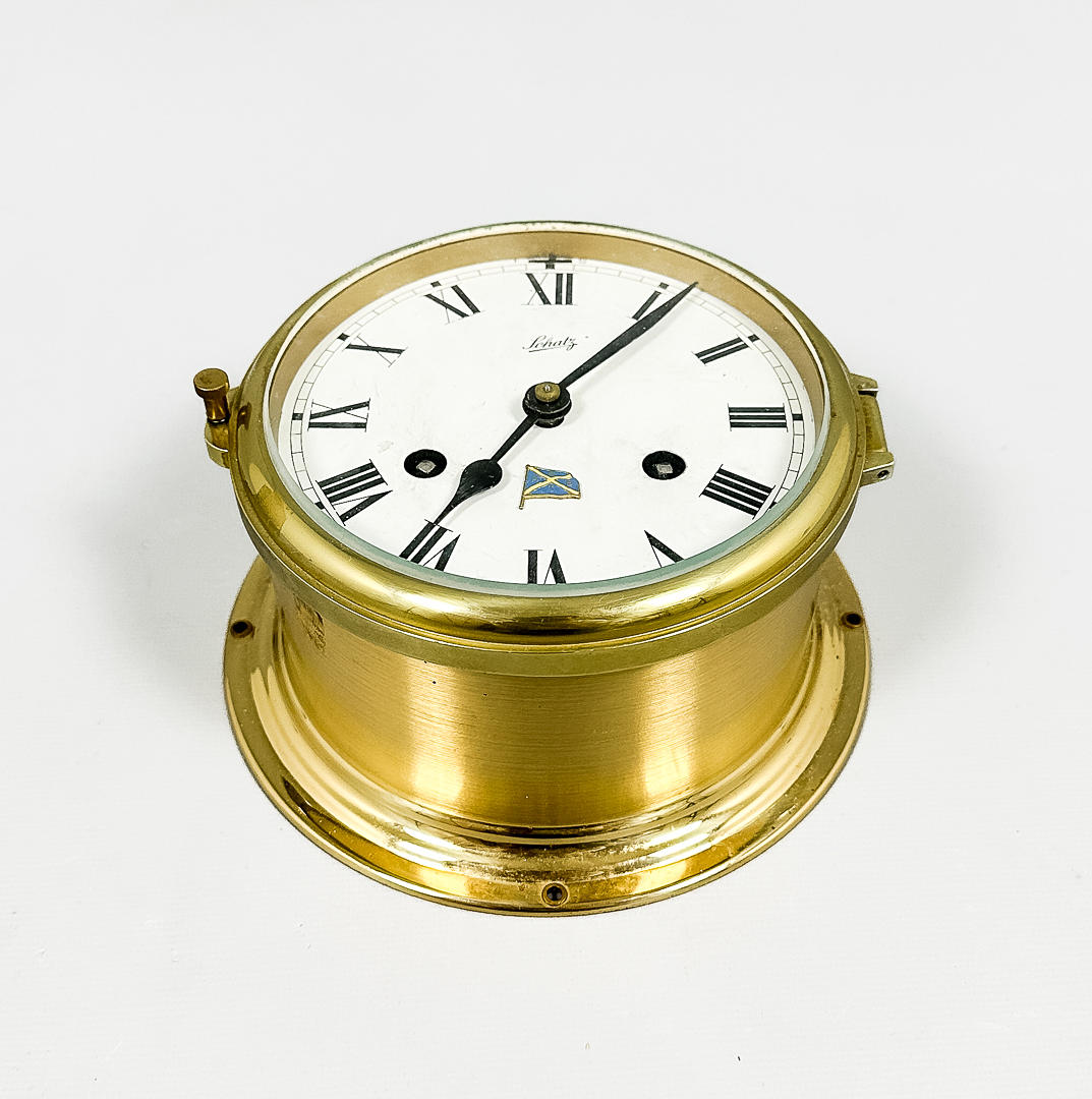 A brass ship clock, Schatz, 20th century.