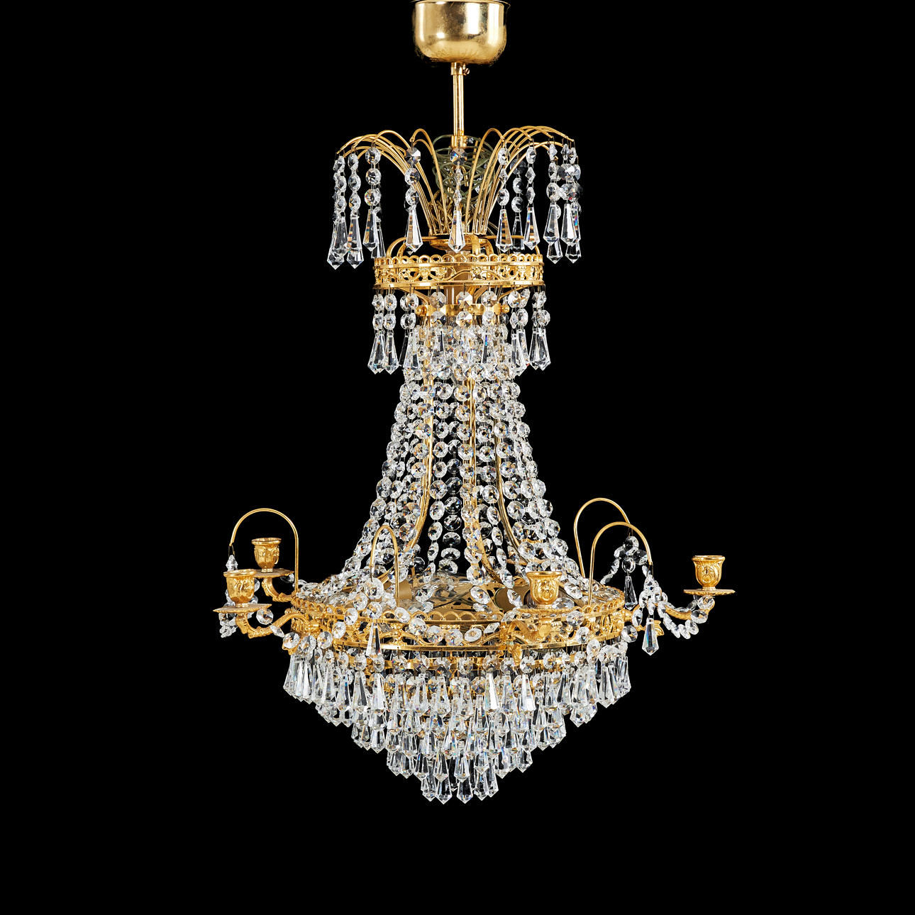 CHANDELIER. Empire style, brass frame, six light points, different cut prisms.