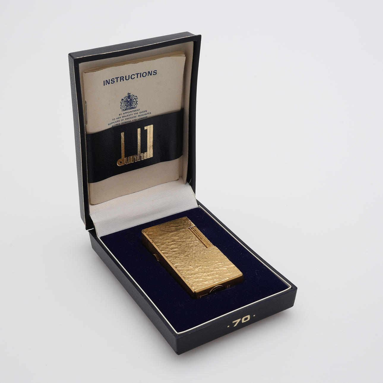 A DUNHILL LIGHTER, “70", gilt, in case.