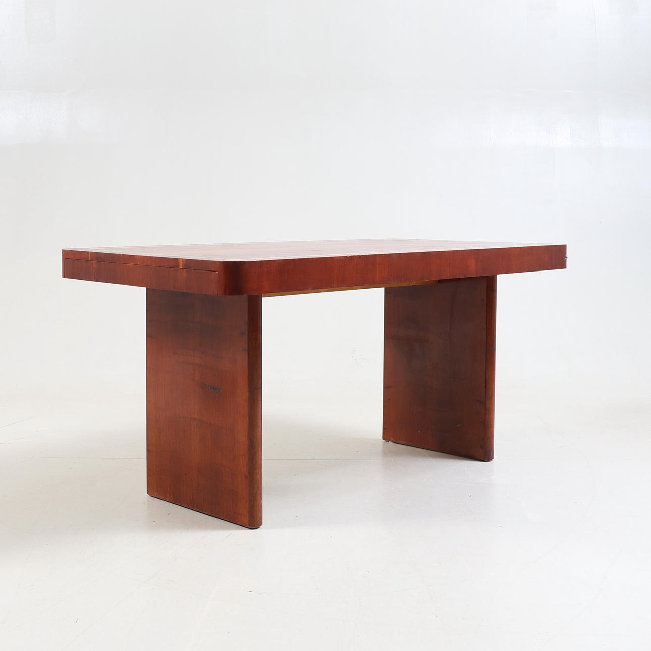 A 1930's art deco mahogany table.