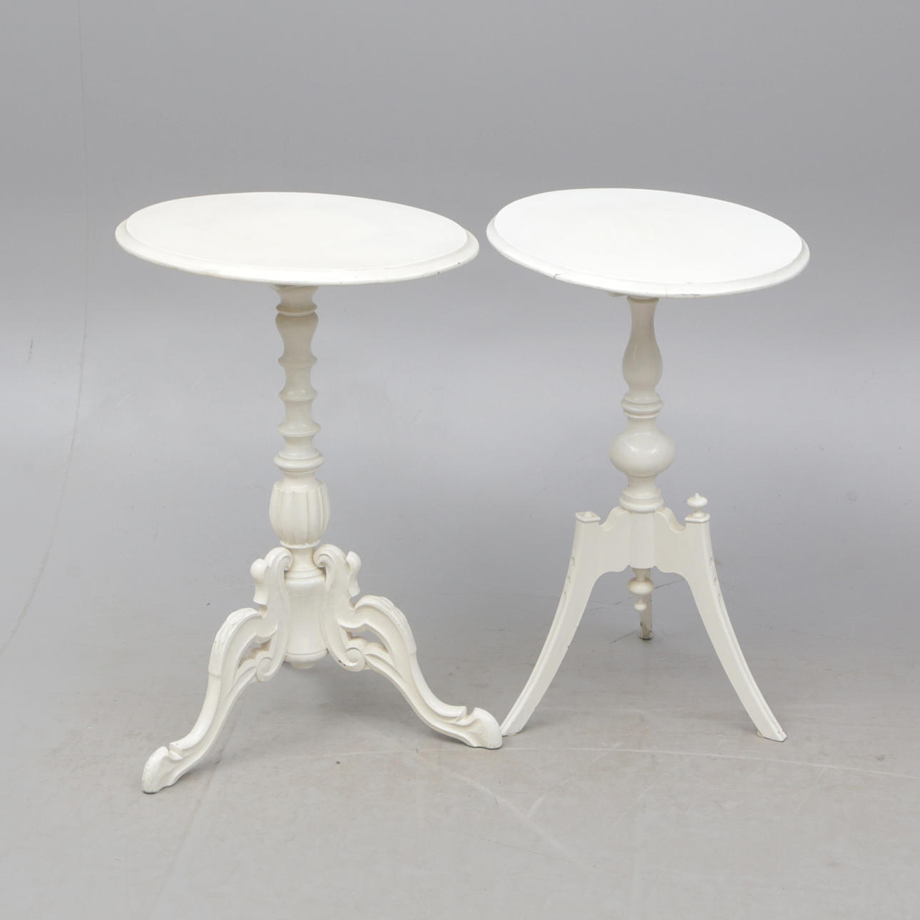 A set of two 20th century pillared tables.