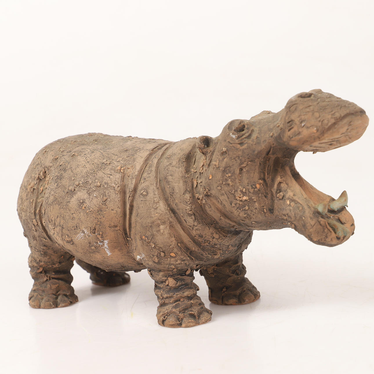 A ceramic hippopotamus figurine, Tilgmans, signed.