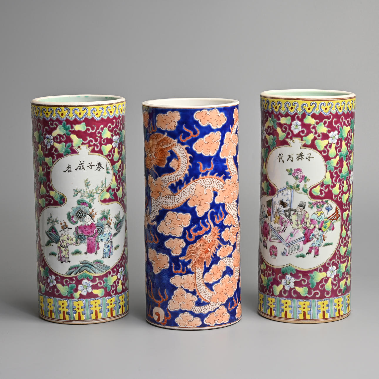 THREE CHINESE POLYCHROME DECORATED PORCELAIN SLEEVE VASES.