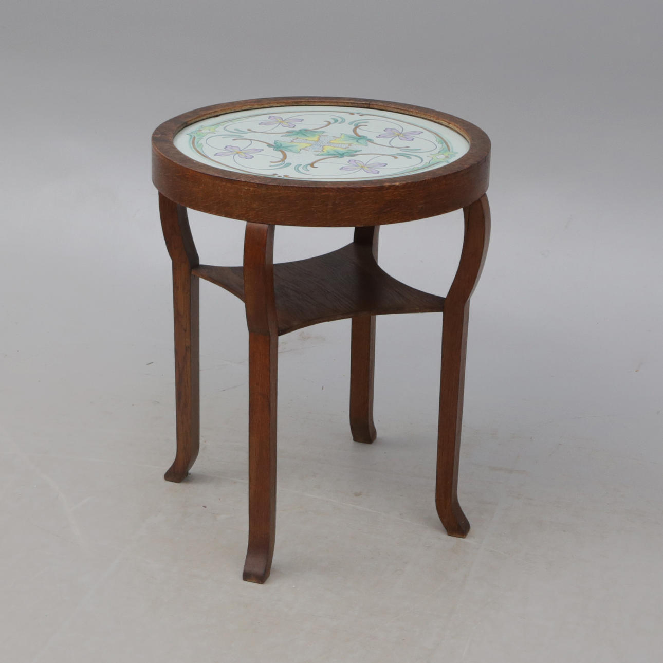 ATTRIBUTED TO JOHN SJÖSTRAND. An oak/faience table, Kalmar faience, painted, early 20th century.