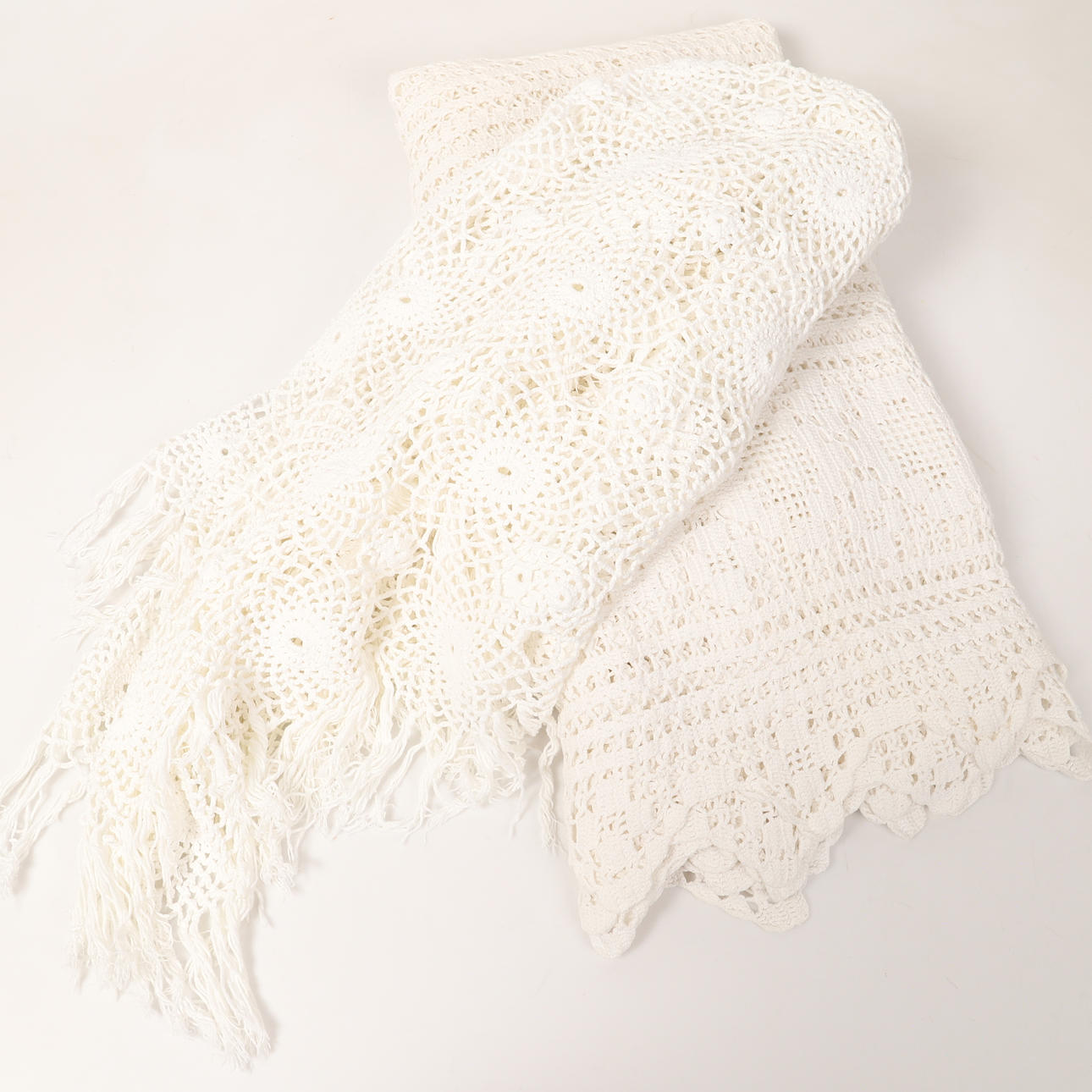 A crocheted bedspread and tablecloth, 20th century.