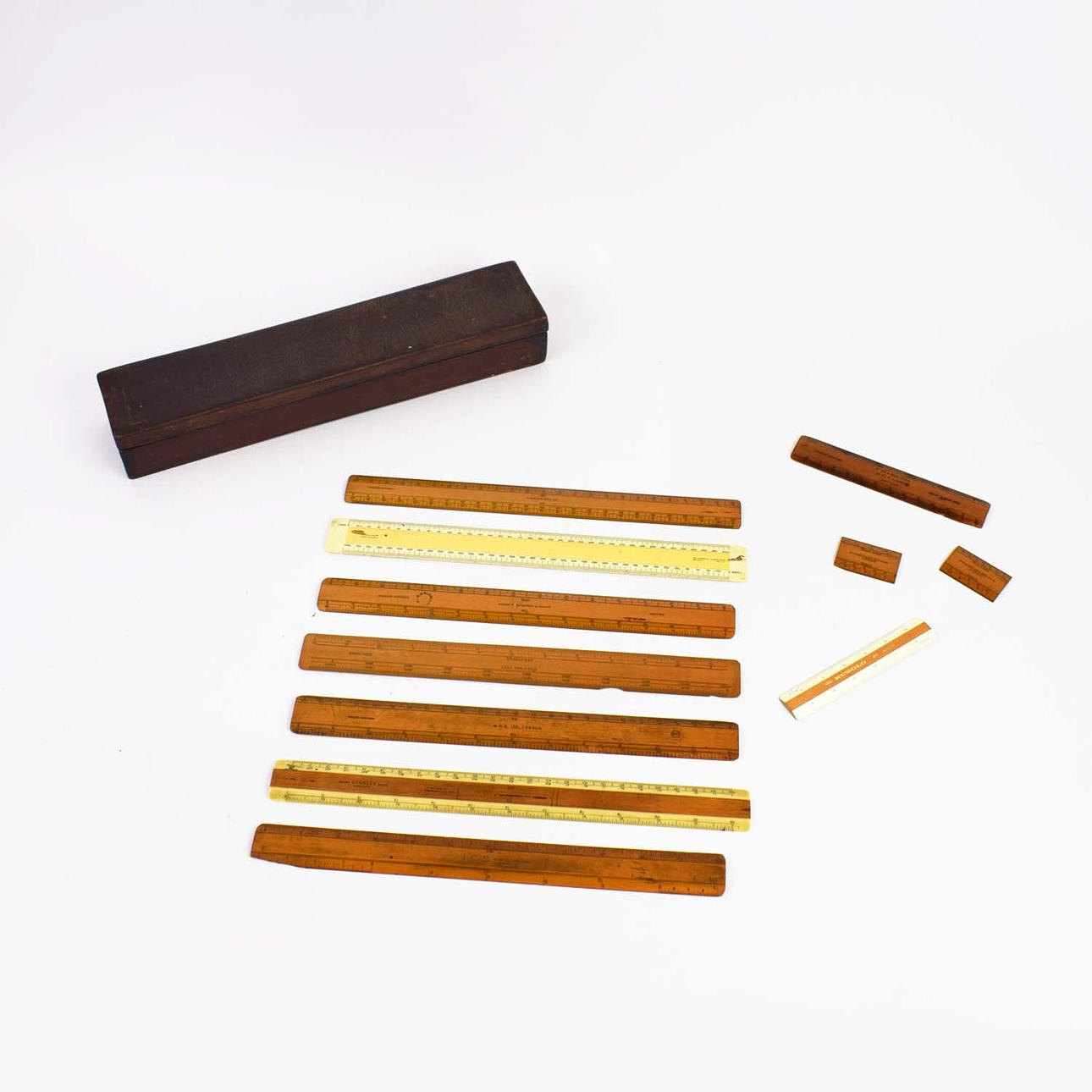 A COLLECTION OF BOXED VICTORIAN DRAFTSMAN RULERS.