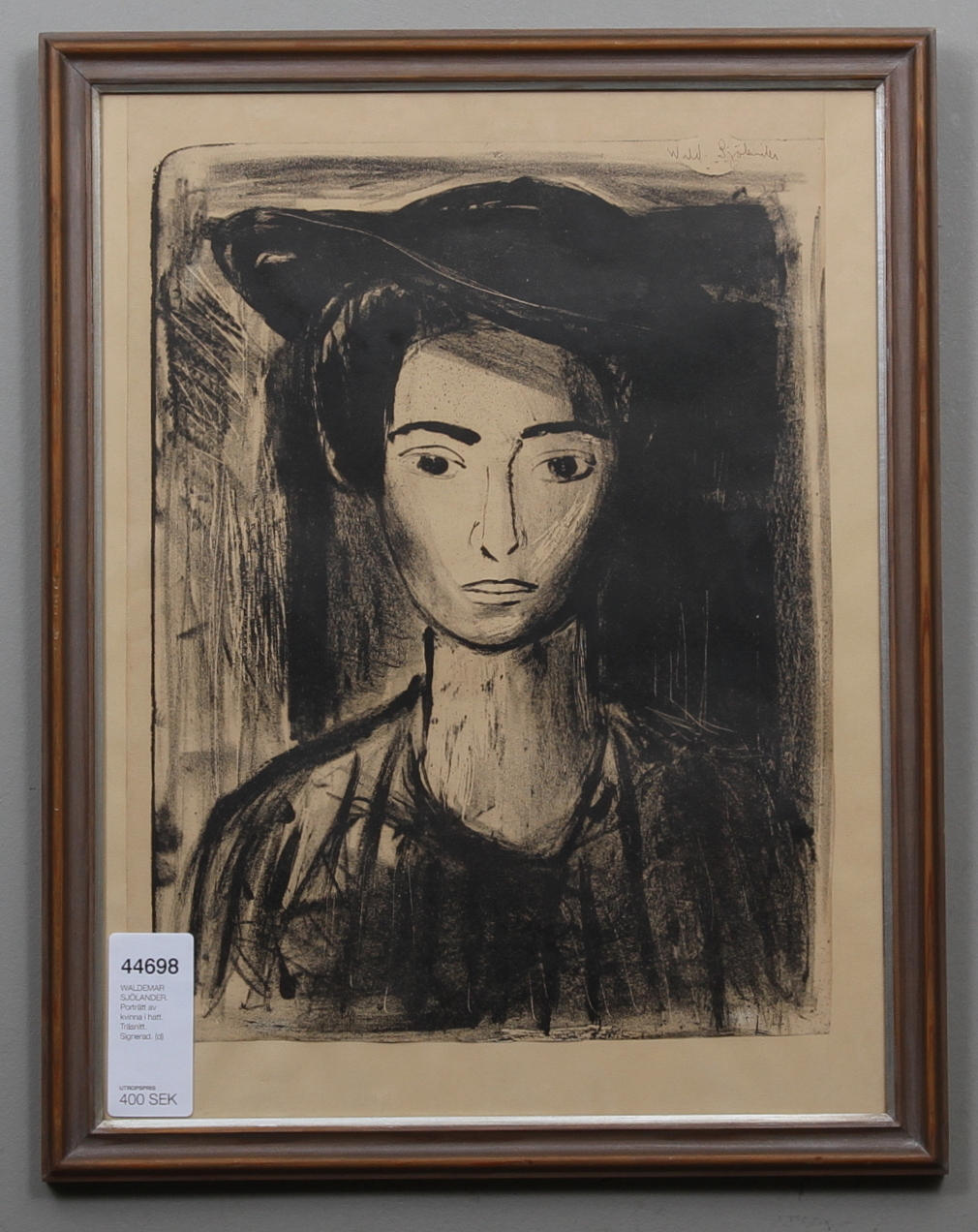 WALDEMAR SJÖLANDER. Porträtt av kvinna i hatt. Träsnitt. Signerad.