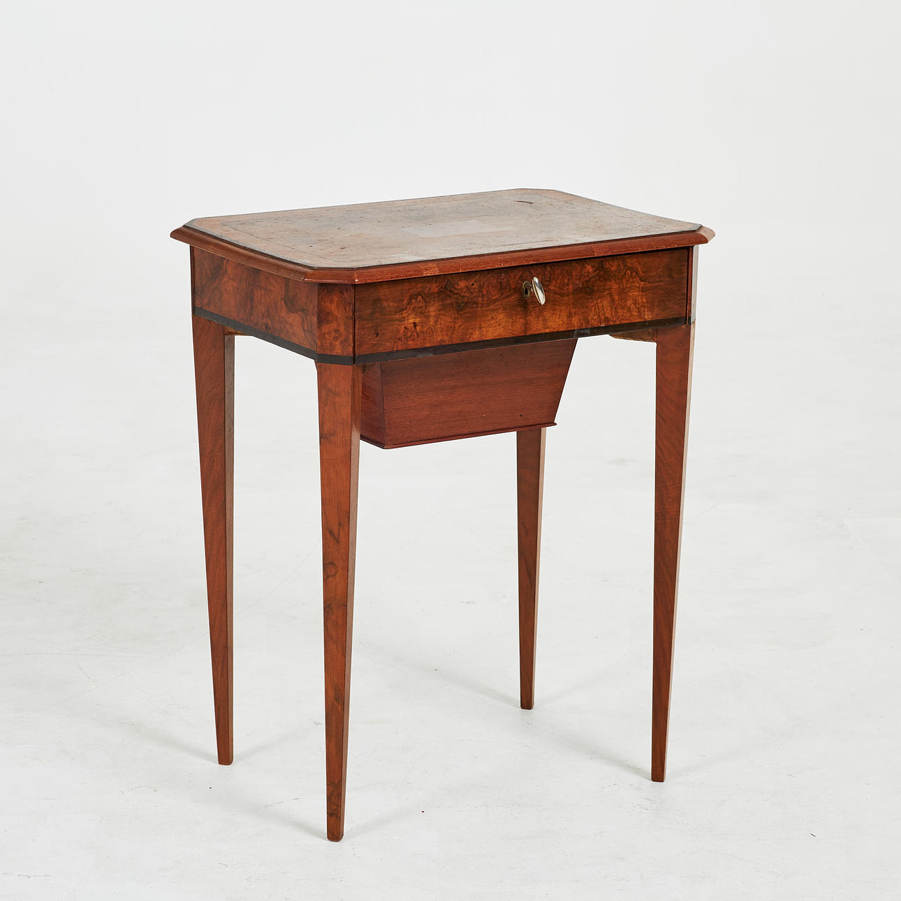 A 19th century sewing table, walnut, decorated with compartments, pull-out drawer at the bottom.