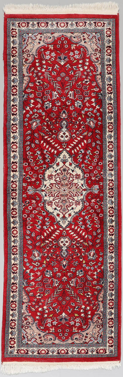 A Persian hand-knotted gallery carpet.