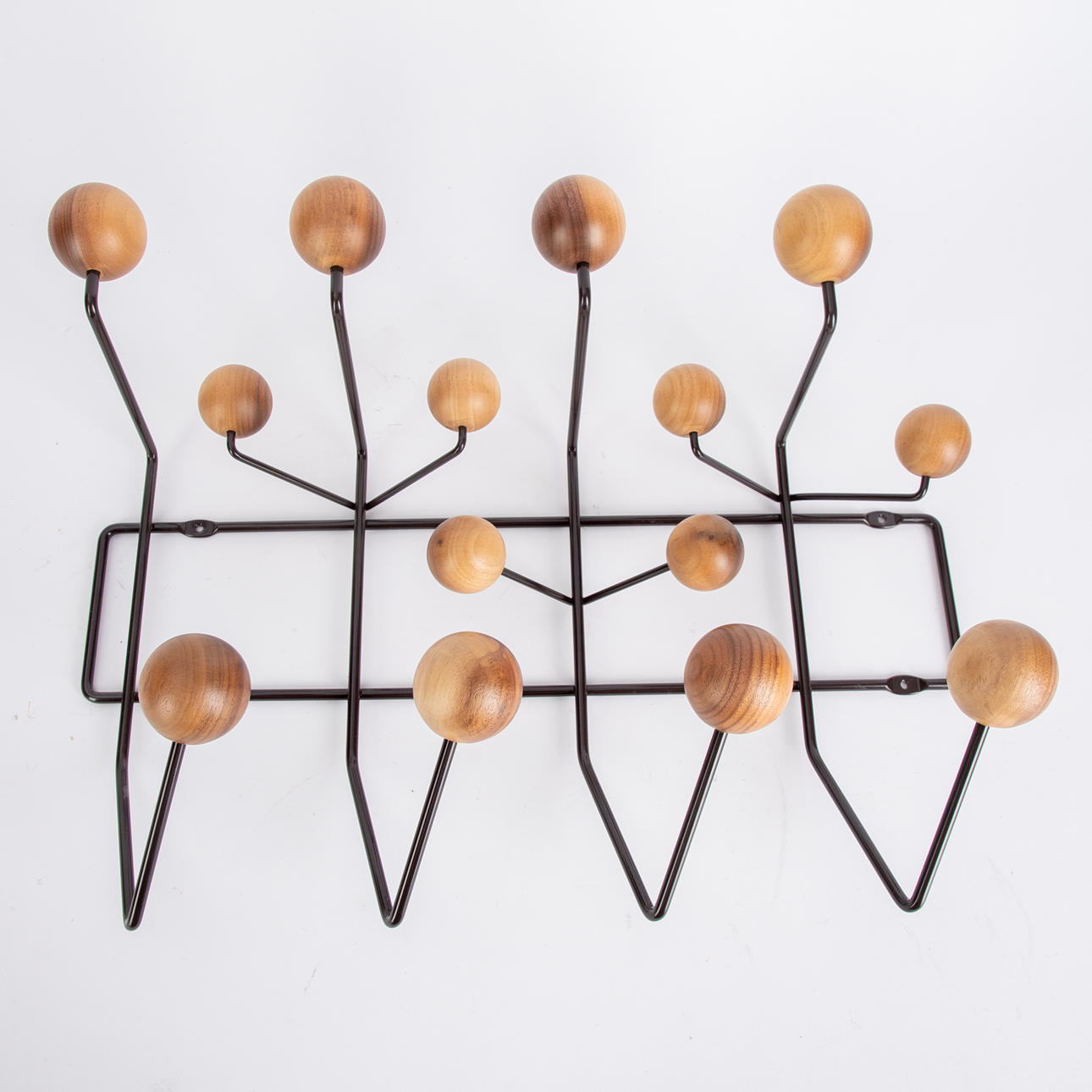 RAY & CHARLES EAMES. Vitra. “Hang it all” walnut/chocolate wall coat rack.
