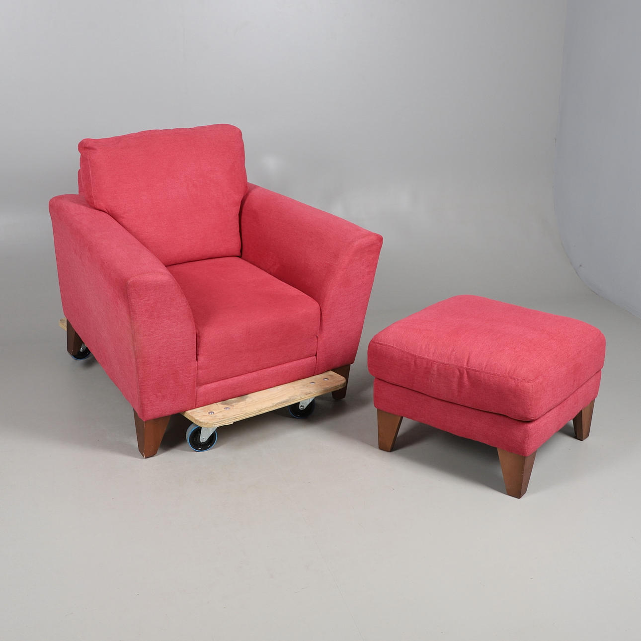 UPHOLSTERED MODERN ARMCHAIR & FOOTSTOOL.