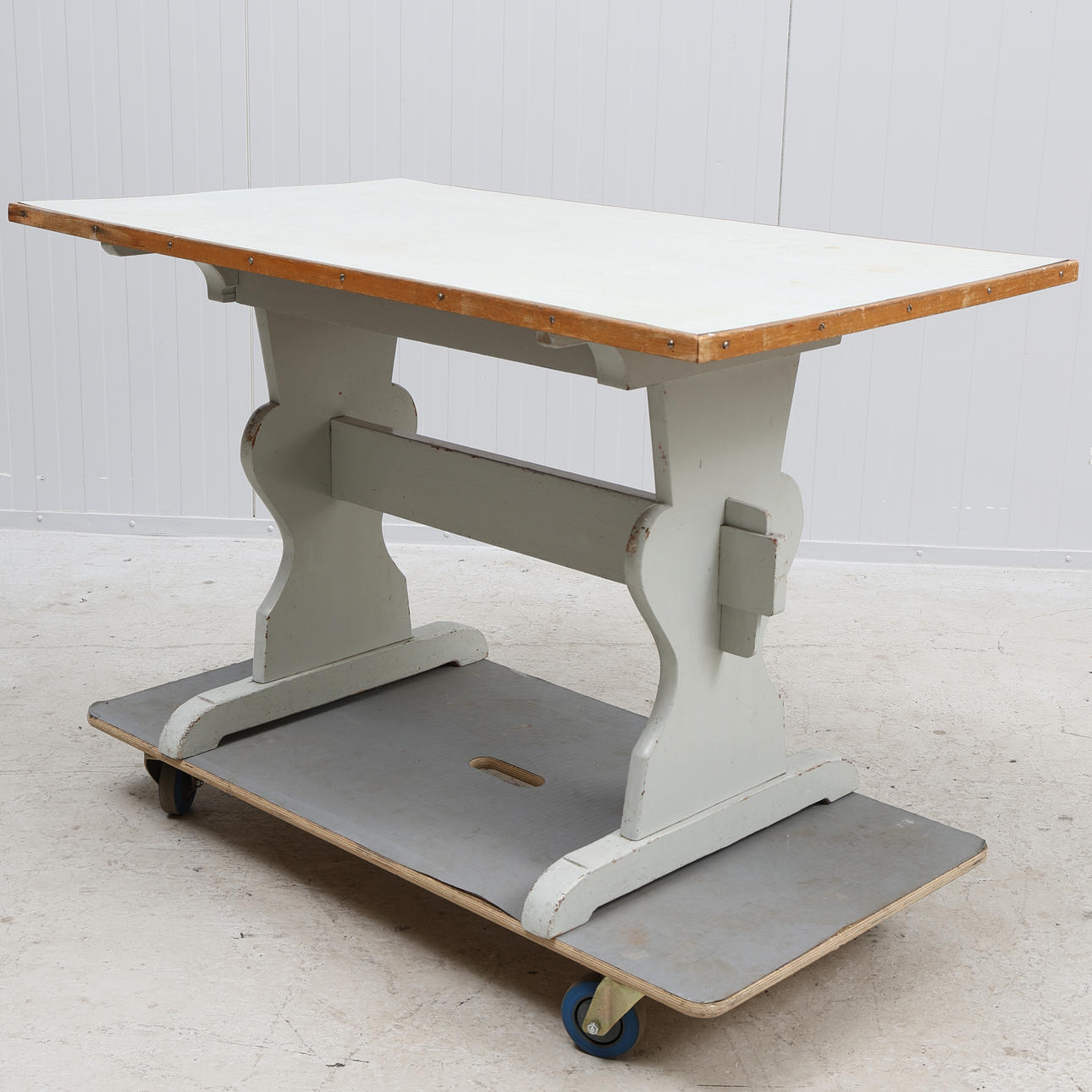 A table, wood with laminate top, 20th century.