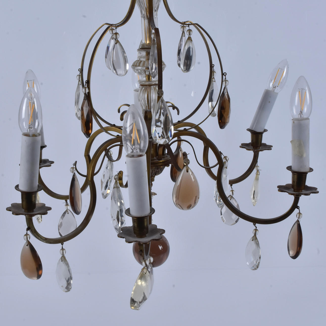 CEILING CHANDELIER, brass with partly coloured prisms.