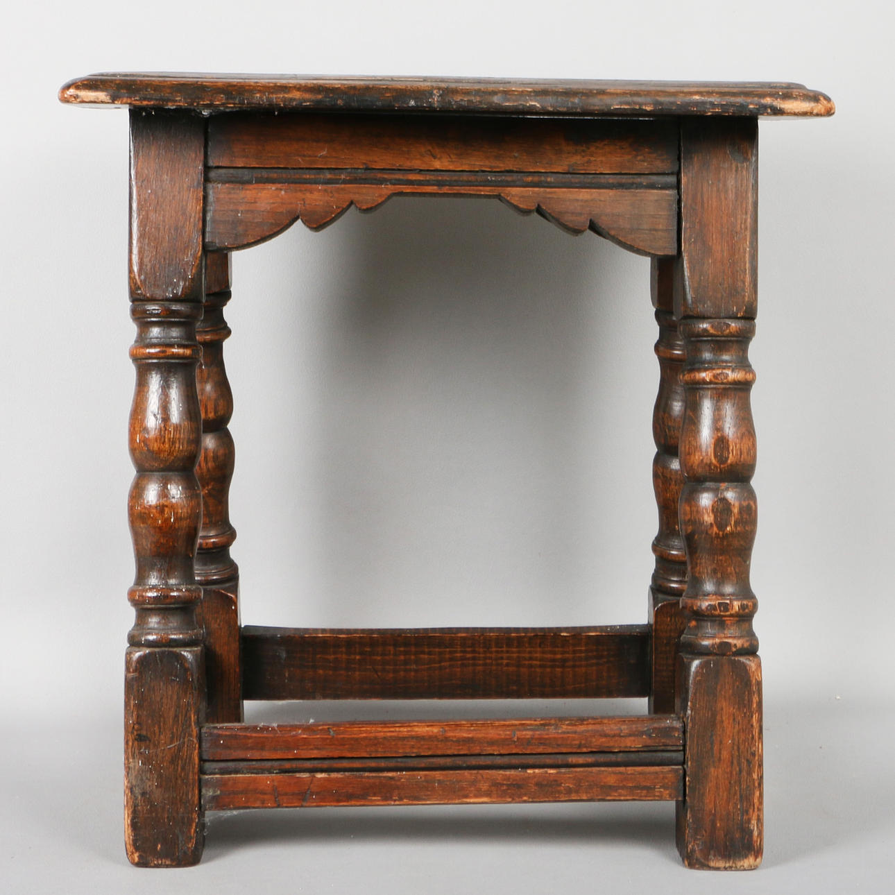 AN OAK JOINT STOOL.