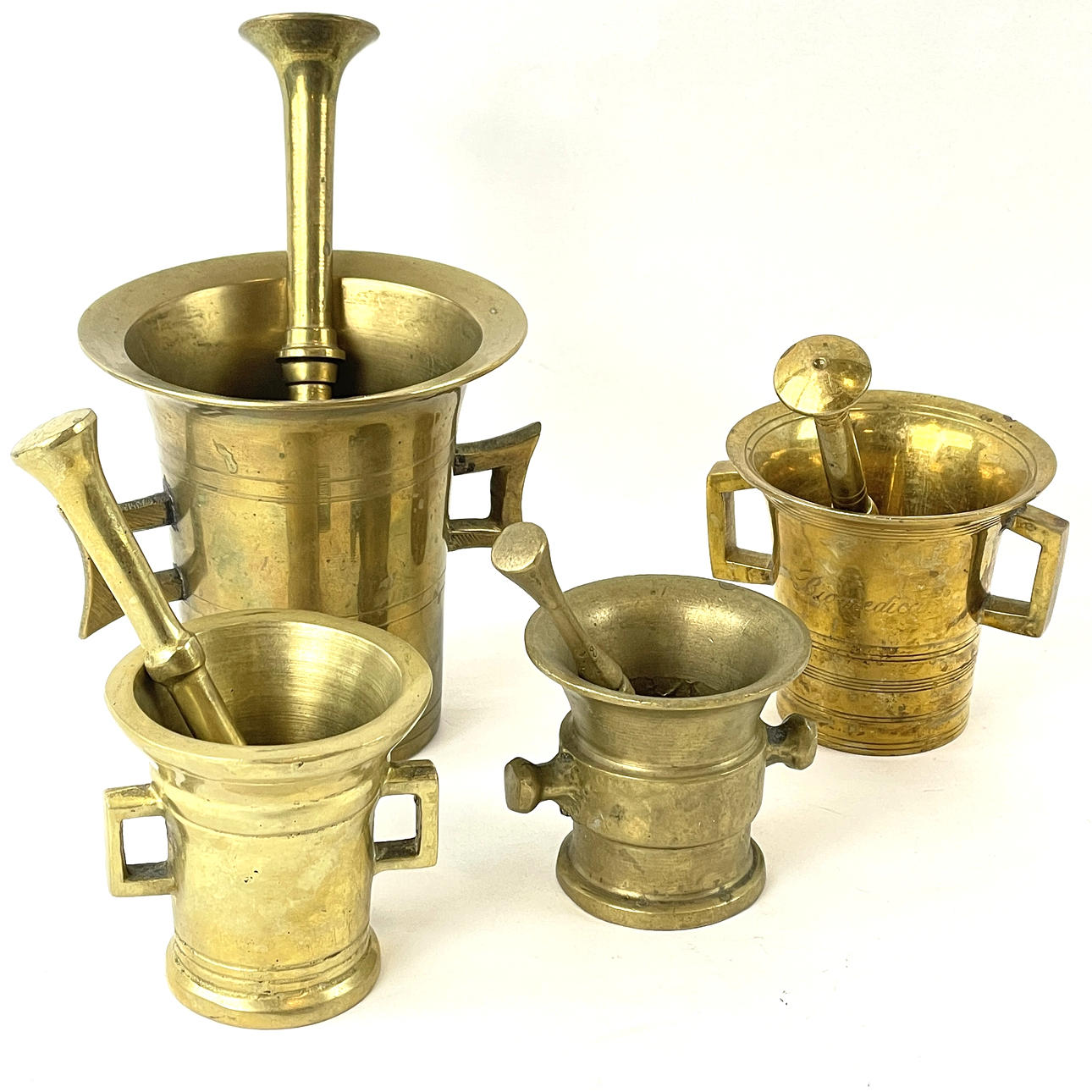 MORTARS with shocks, 4 pcs. Brass, 20th century.