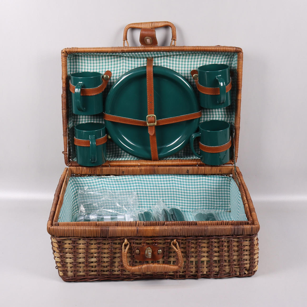 PICNIC BASKET, rattan with plastic tableware.