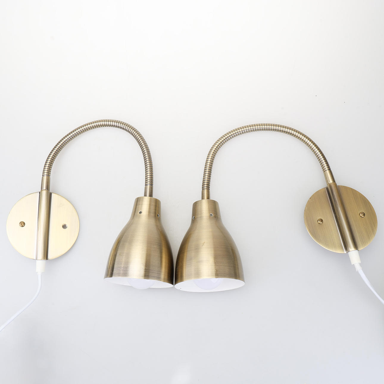 WALL LAMPS, a pair, brass, adjustable.