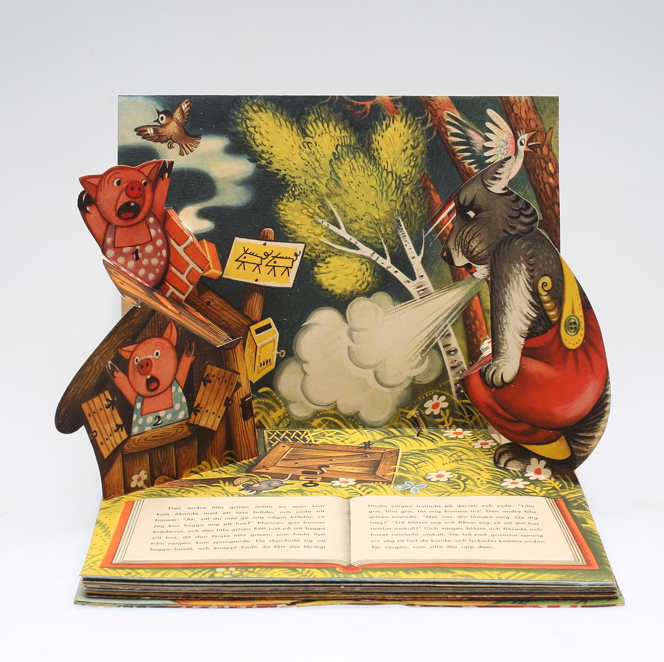 BARNBOK, Tre små grisar samt Guldlock och de tre björnarna, med pop-up bilder.