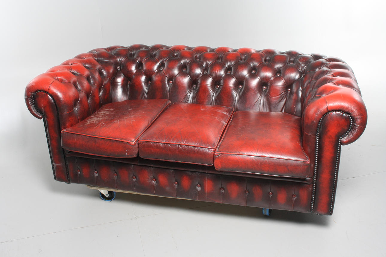 SOFA, oxblood colored leather, Chesterfield model.
