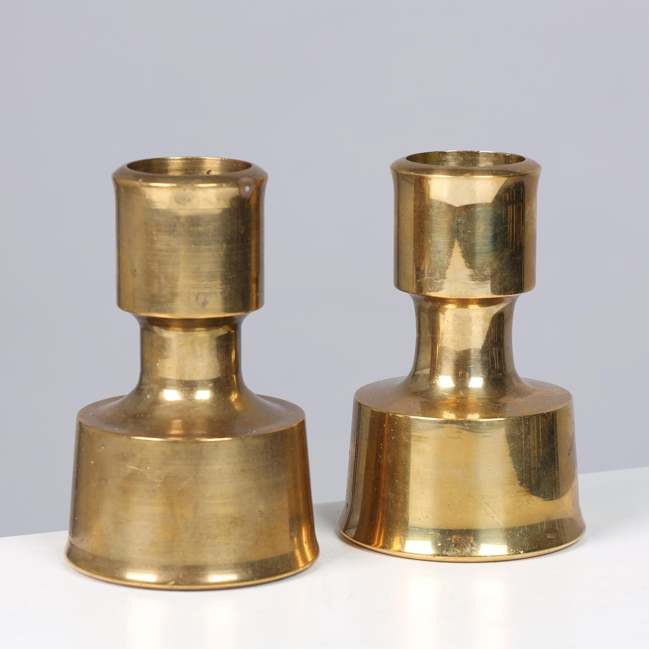 JENS HARALD QUISTGAARD (1919-2008). A pair of solid brass 'Magic Lantern' candlesticks, 1960-70s (2).