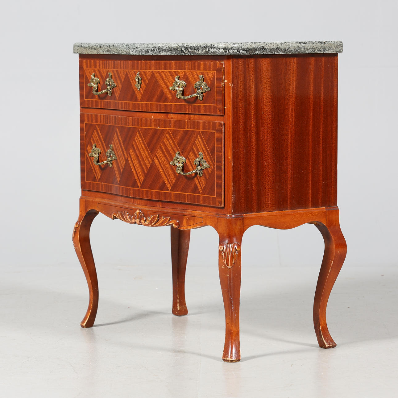 Chest of drawers with stone top, rococo style.
