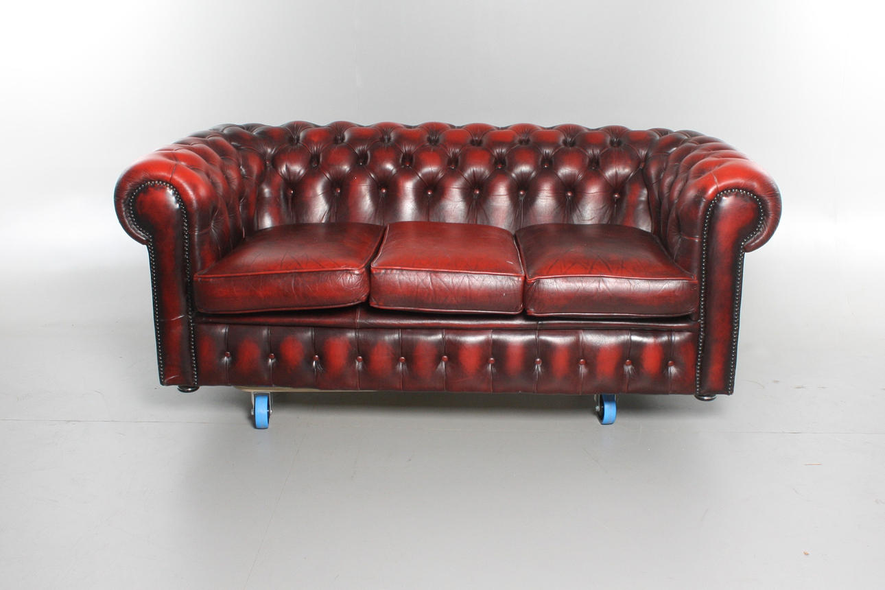 SOFA, oxblood colored leather, Chesterfield model.