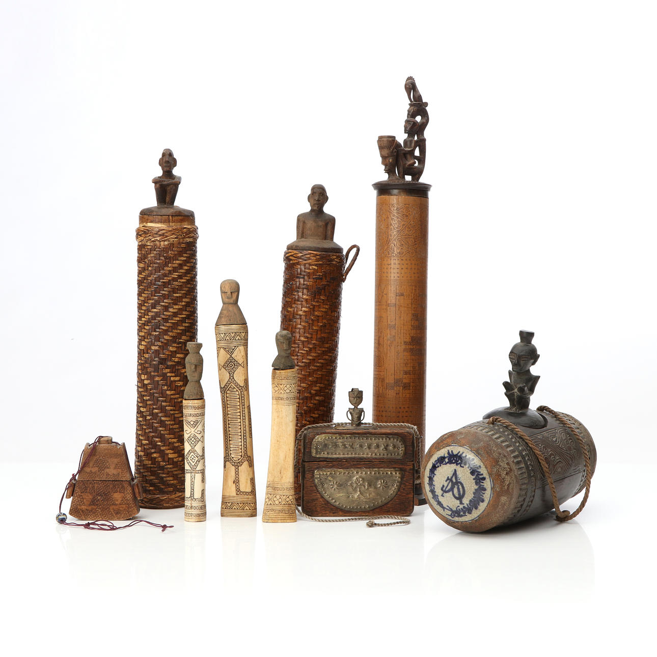 NINE CONTAINERS, MOSTLY AFRICAN.