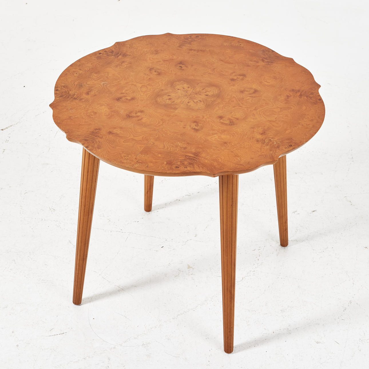 TABLE; lounge table, 1940s, Swedish modern, contoured board veneered in birch root, cannellated legs.