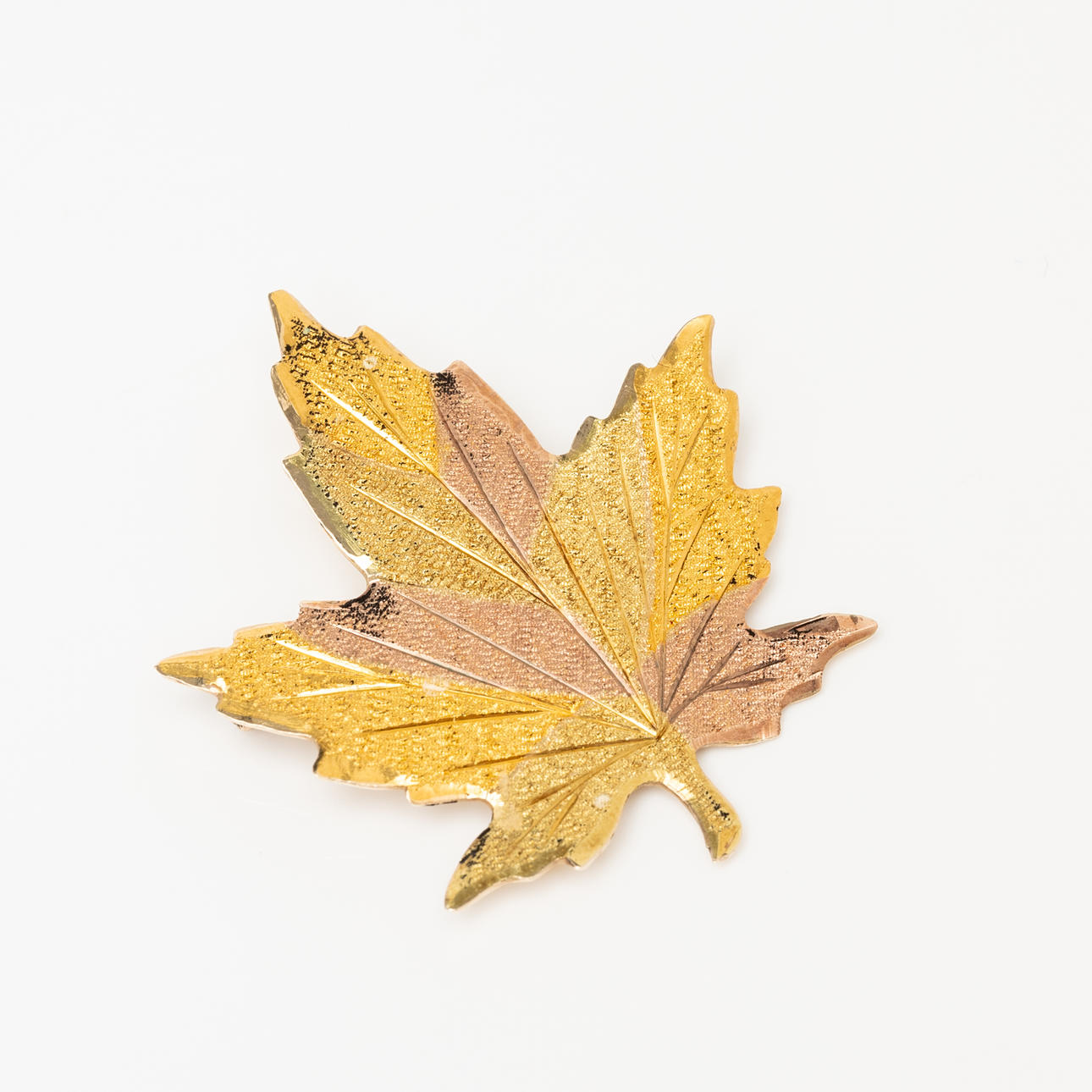 A 14K gold brooch, leaf shape, indistinct stamp.