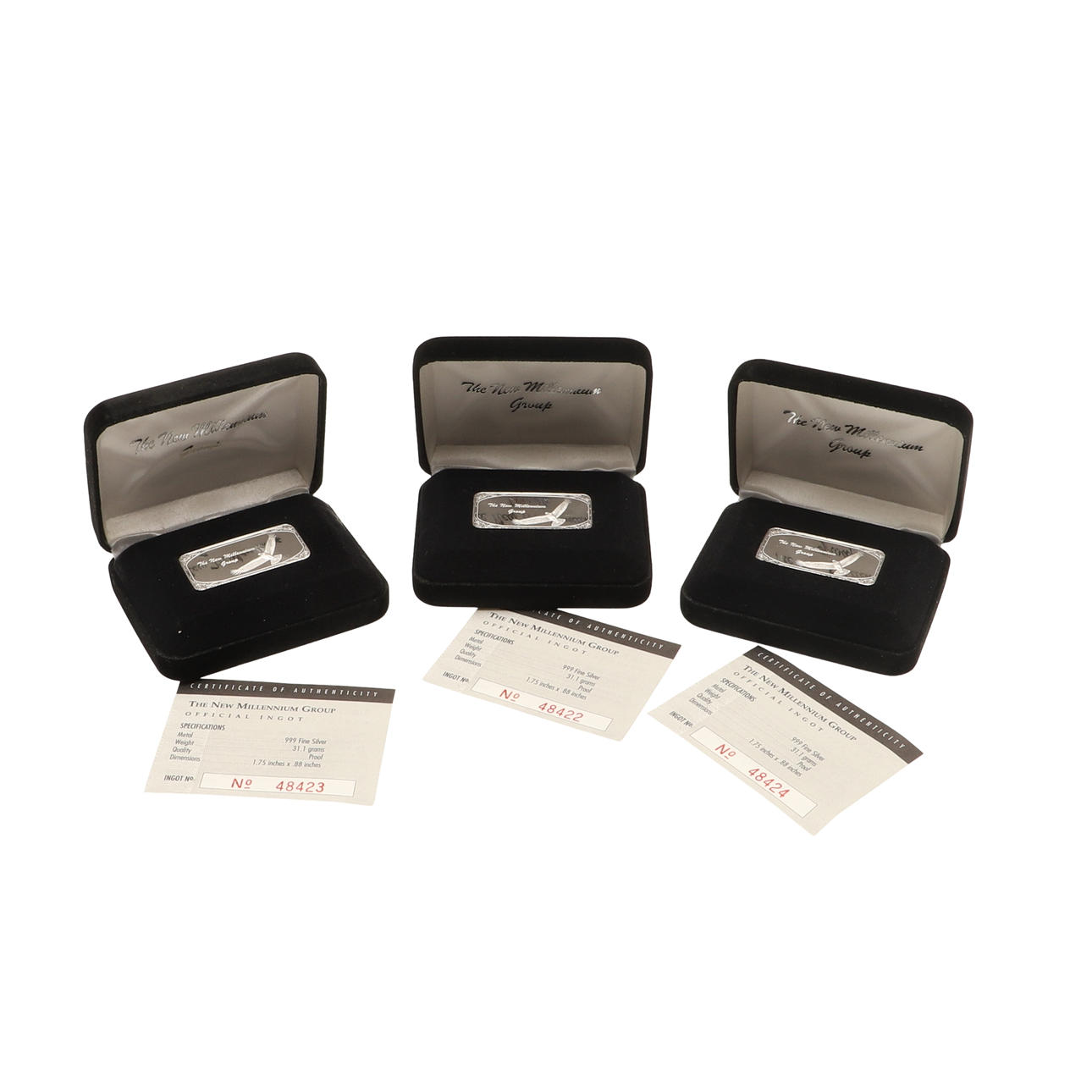 THREE BOXED SILVER INGOTS.