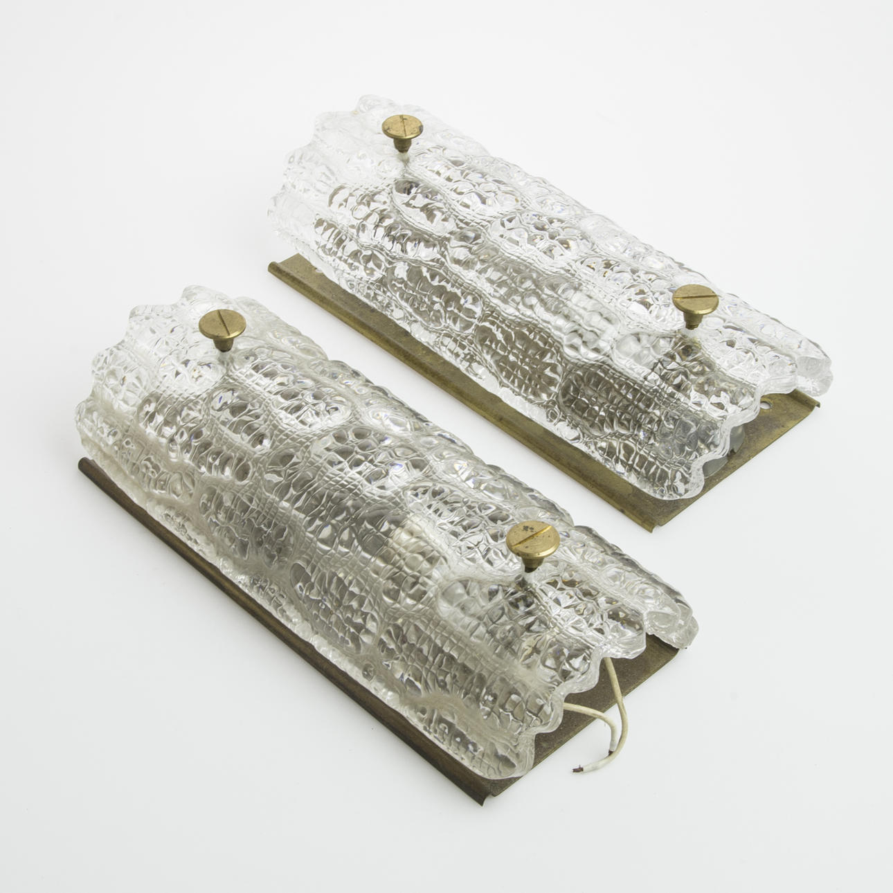 VÄGGLAMPETTER, 1 par, glas/mässing, Carl Fagerlund, Orrefors.